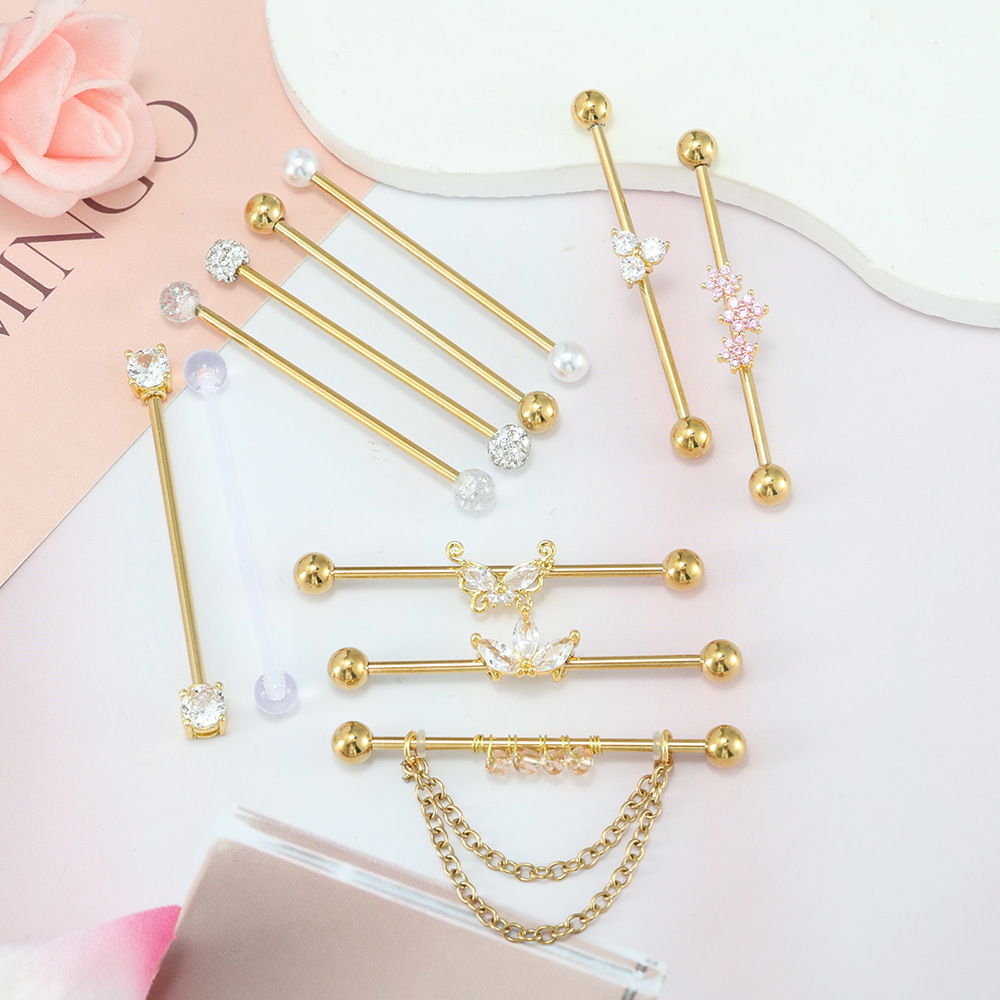 Vergulde industriële piercing  - Body Jewelry Barbell recensie en prijs